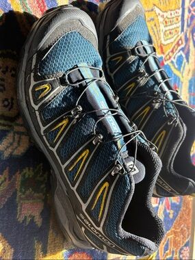 Salomon teal and yellow trail running shoes